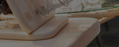 Close-up of protective basswood base with Glow Infrared Therapy Light resting on it