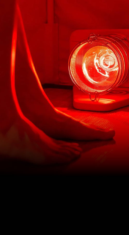 Woman's feet in FireLight Infrared Sauna in front of Glow Infrared Therapy Light that is on floor of sauna.