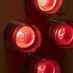 SaunaSpace Hearth Quartet Infrared Therapy Sauna Panel - close up of bulb guards with lights on