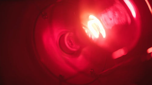 Close-up of FireLight Infrared Bulb inside SaunaSpace light panel