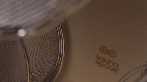 Close-up of sustainably-harvested, untreated, hand-polished basswood panel of SaunaSpace light panels