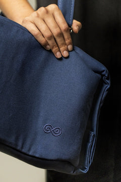 SaunaSpace Travel Soft Case for Glow Infrared Therapy Light - Indigo - woman holding case close-up