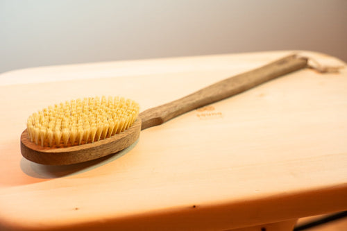SaunaSpace natural exfoliating brush with teak handle and tampico bristles