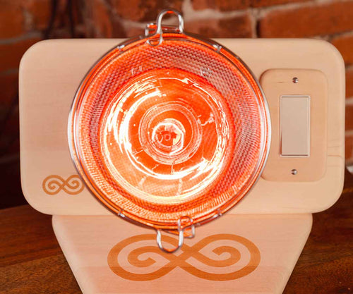 SaunaSpace Glow Infrared Therapy Light - on Basswood Glow Base with front tilted up