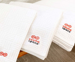 SaunaSpace Bath Towel - on bench