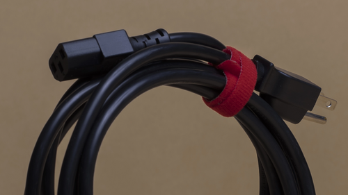 SaunaSpace Shielded Power Cord wound up and tied with red velcro tie