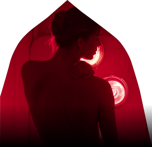Woman with eyes closed sitting in FireLight Infrared Sauna with lights on