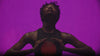 People moving under violet and red light and silhouettes and interacting with SaunaSpace products in dimly lit background