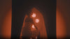 Stylized scenes of models sweating, using SaunaSpace FireLight Sauna, Glow and Hearth