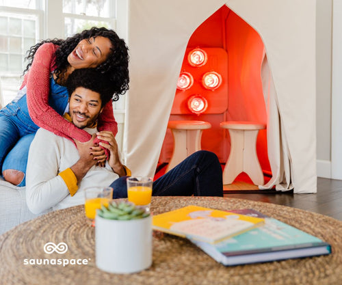 SaunaSpace Gift Card - family in living room in front of SaunaSpace FireLight® Sauna